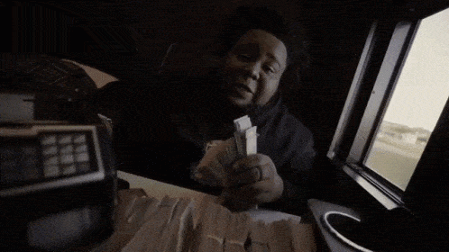 Man Holding Stack of Money