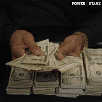 Man Holding Stack of Money