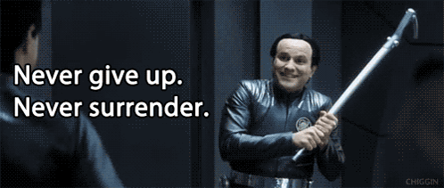 Man Holding Stick With Never Give Up Surrender GIF