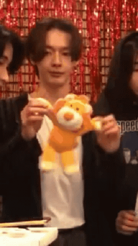 Man Holding Stuffed Animal GIF