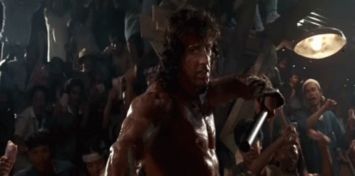 Man Holding Sword in Front of Crowd