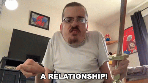 Man Holding Sword Saying A Relationship GIF