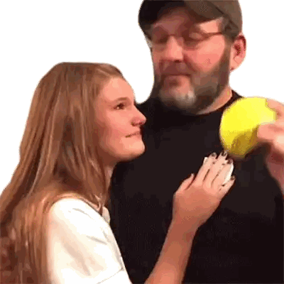 Man Holding Tennis Ball Woman Watching