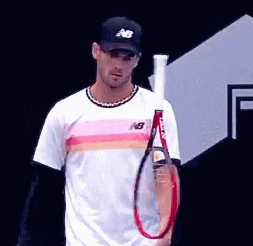 Man Holding Tennis Racquet