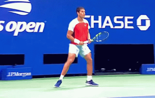 Man Holding Tennis Racquet Chase Advertisement GIF