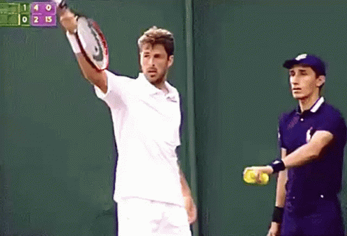 Man Holding Tennis Racquet in Front of Scoreboard 140