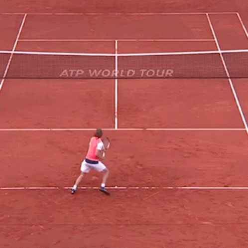 Man Holding Tennis Racquet