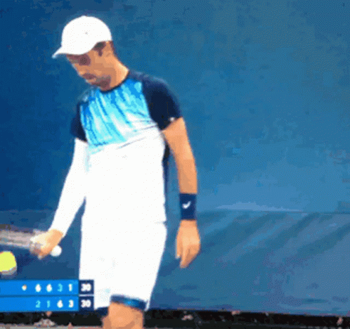 Man Holding Tennis Racquet GIF