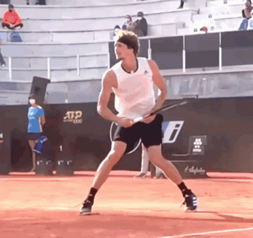 Man Holding Tennis Racquet on ATP Court