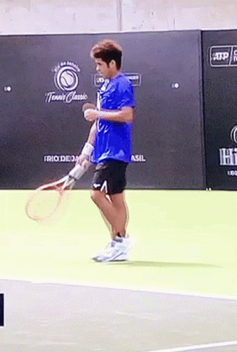 Man Holding Tennis Racquet On Court GIF