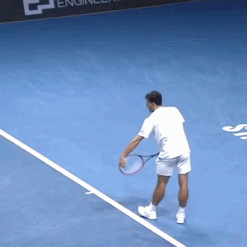 Man Holding Tennis Racquet GIF