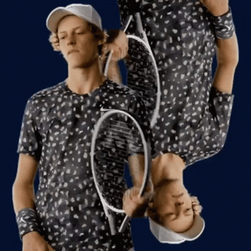 Man Holding Tennis Racquet Upside Down GIF