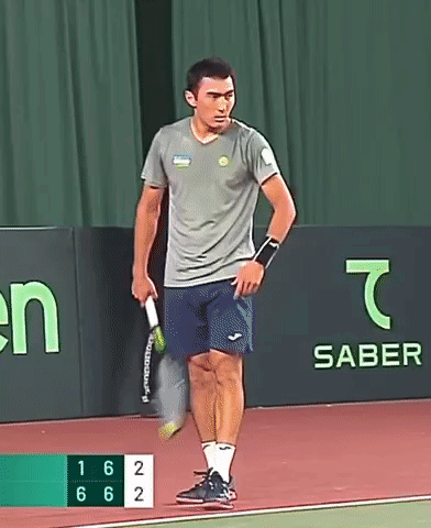 Man Holding Tennis Racquet with Saber Banner