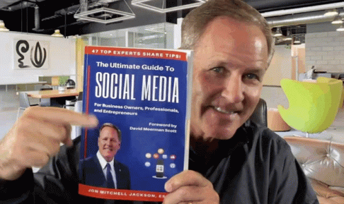 Man Holding The Ultimate Guide To Social Media GIF