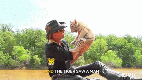Man Holding Tiger Cub The Tiger Saw a Man