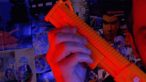 Man Holding Toy Gun That Says Wired