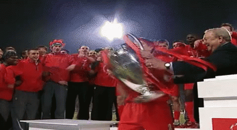 Man Holding Trophy GIF