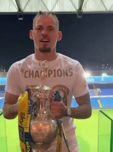 Man Holding Trophy Saying Champions GIF