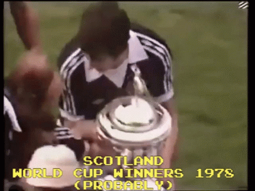 Man Holding Trophy Saying Scotland World Cup Winners Probably GIF
