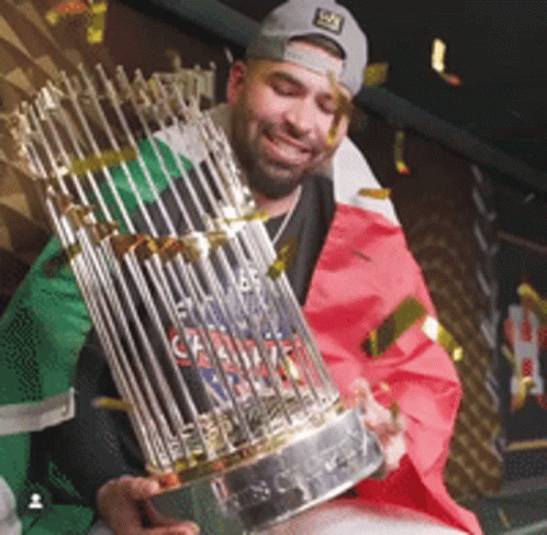 Man Holding Trophy with Canadian Flag