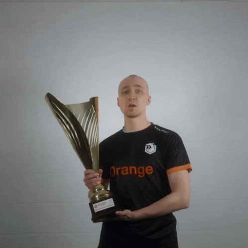 Man Holding Trophy With Orange Shirt GIF