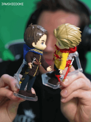 Man Holding Two Action Figures Jawshiedomi GIF