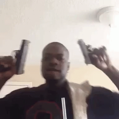 Man Holding Two Guns With Straw