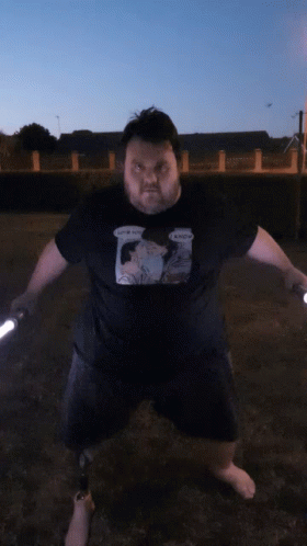 Man Holding Two Lightsabers