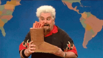 Man Holding Ugg Boots In Front Of World Map GIF