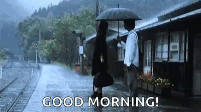 Man Holding Umbrella Over Woman