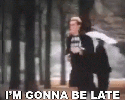 Man Holding Umbrella Saying I'm Gonna Be Late Walking Through Forest GIF