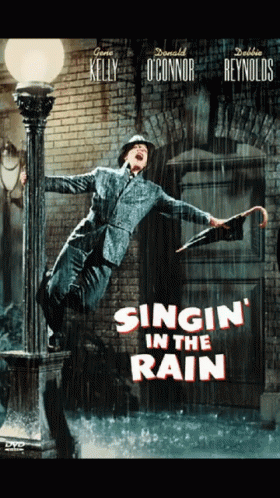 Man Holding Umbrella Singing in the Rain