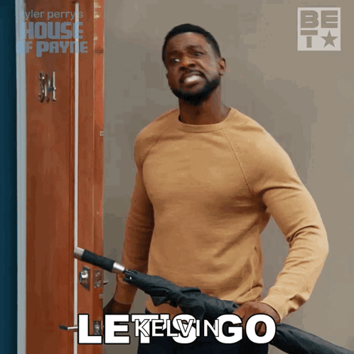 Man Holding Umbrella With Lekelingo