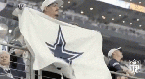 Man Holding White Flag With Blue Star