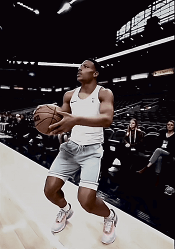 Man Holding Wilson Basketball GIF