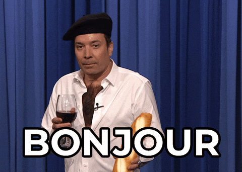 Man Holding Wine Glass And Bread With Bonjour GIF