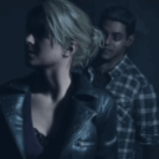 Man Holding Woman's Neck In Dark Room GIF