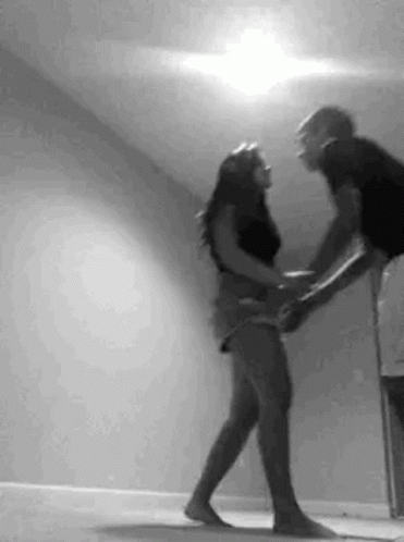 Man Holding Woman While Dancing