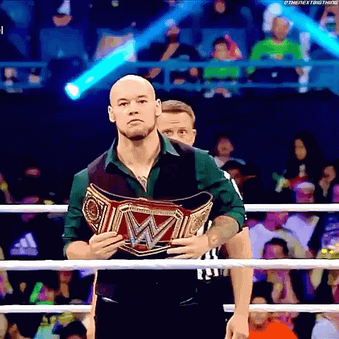 Man Holding Wrestling Championship Belt In Boxing Ring GIF