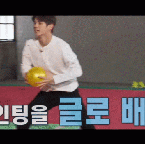 Man Holding Yellow Ball