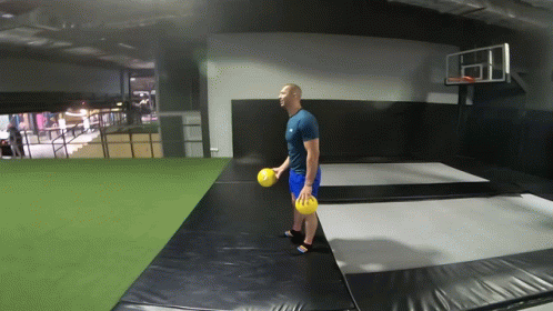 Man Holding Yellow Ball GIF