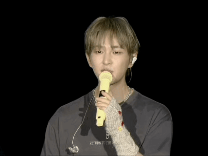 Man Holding Yellow Microphone Saying Return GIF