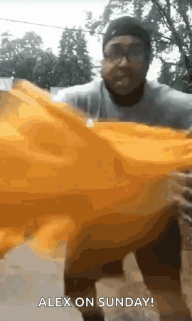 Man Holding Yellow Object Says Alex On Sunday GIF
