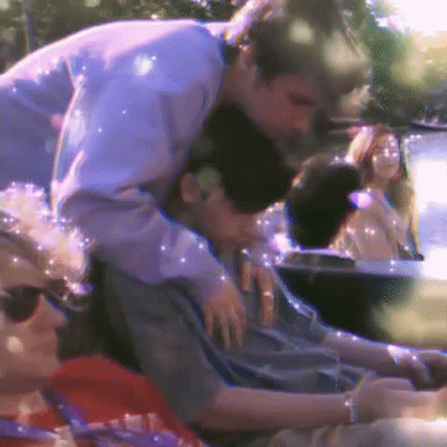 Man Hugging Another Man in Car
