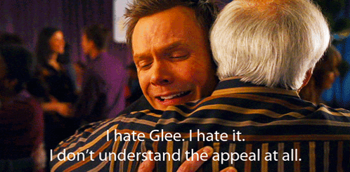 Man Hugging Another Man Saying I Hate Glee
