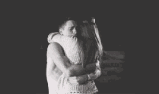 Man Hugging Woman In Black And White Photo GIF