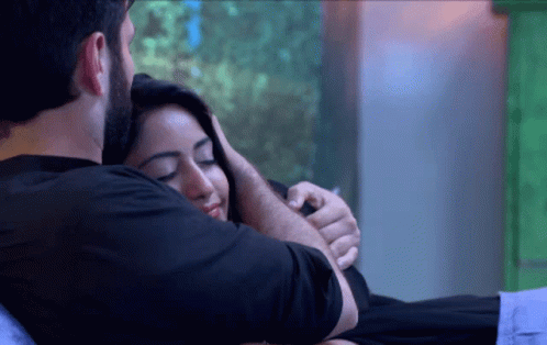 Man Hugging Woman On Bed GIF