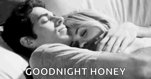 Man Hugging Woman Sleeping In Bed GIF