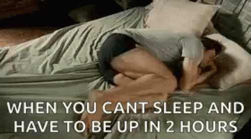 Man Hugging Woman Sleeping On Bed GIF
