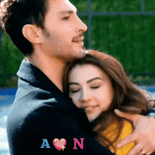 Man Hugging Woman With Initials A and N